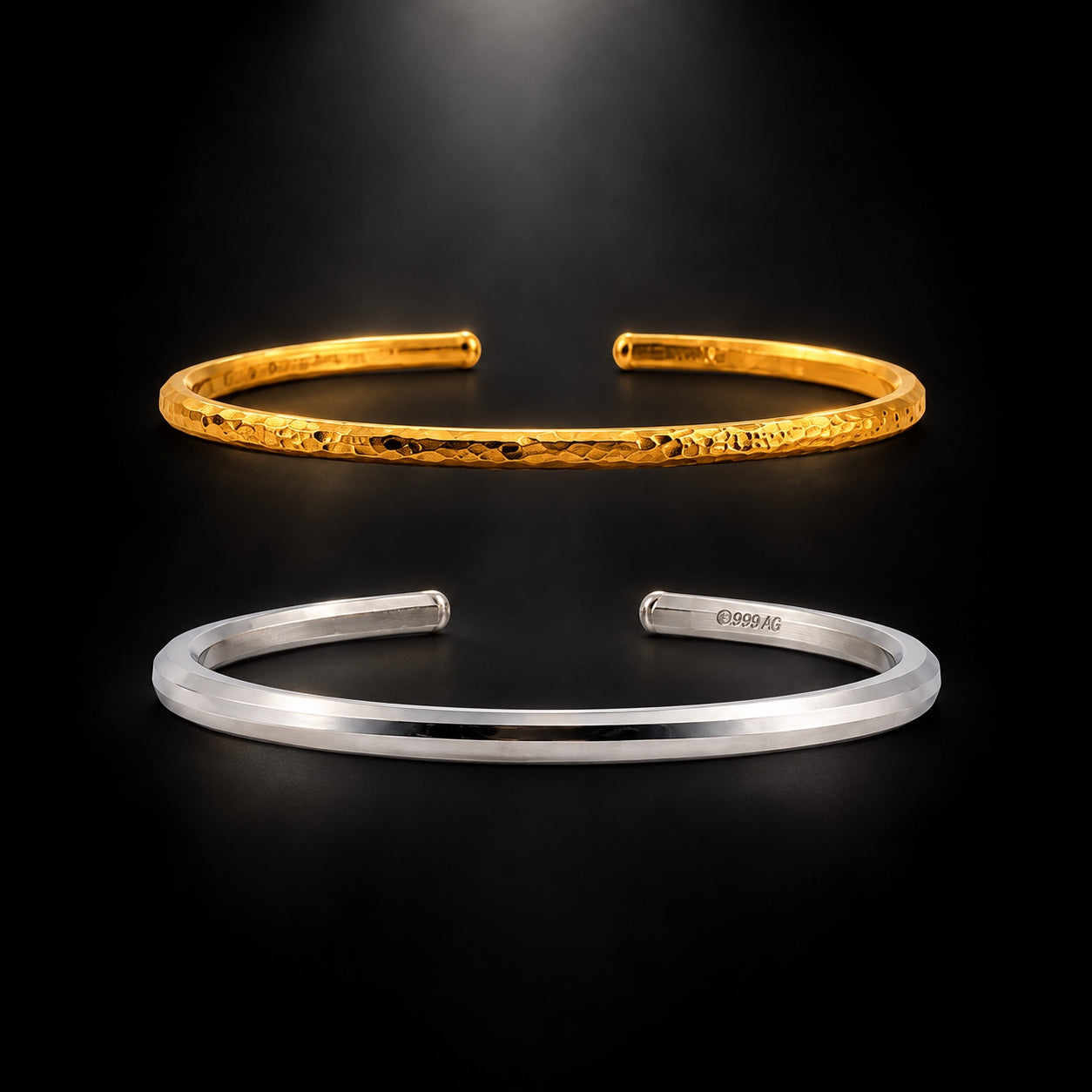 Hammered gold cuff above a polished silver cuff with its photographed 999 AG marking
