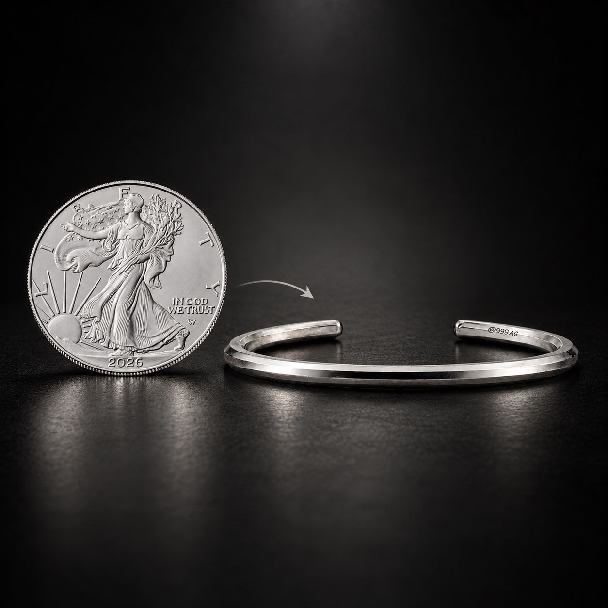 One-ounce silver coin beside the silver Lightning Cuff for a visual comparison