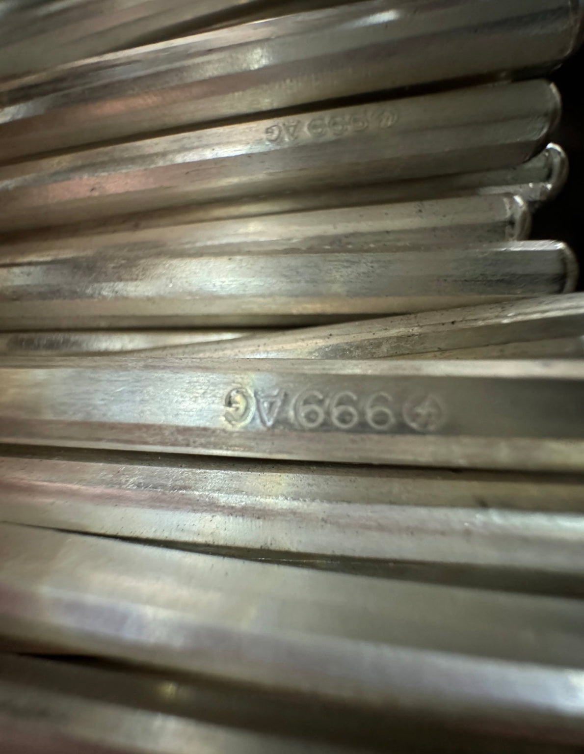 Original close-up photograph of 999 AG purity markings inside silver cuffs