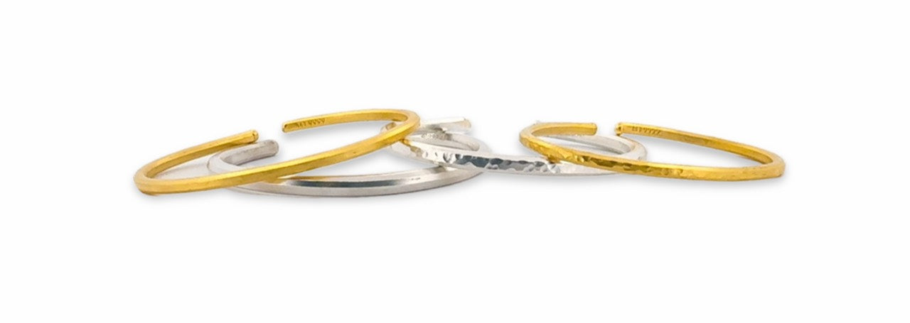 Original photograph showing the makers’ gold and silver bracelets together