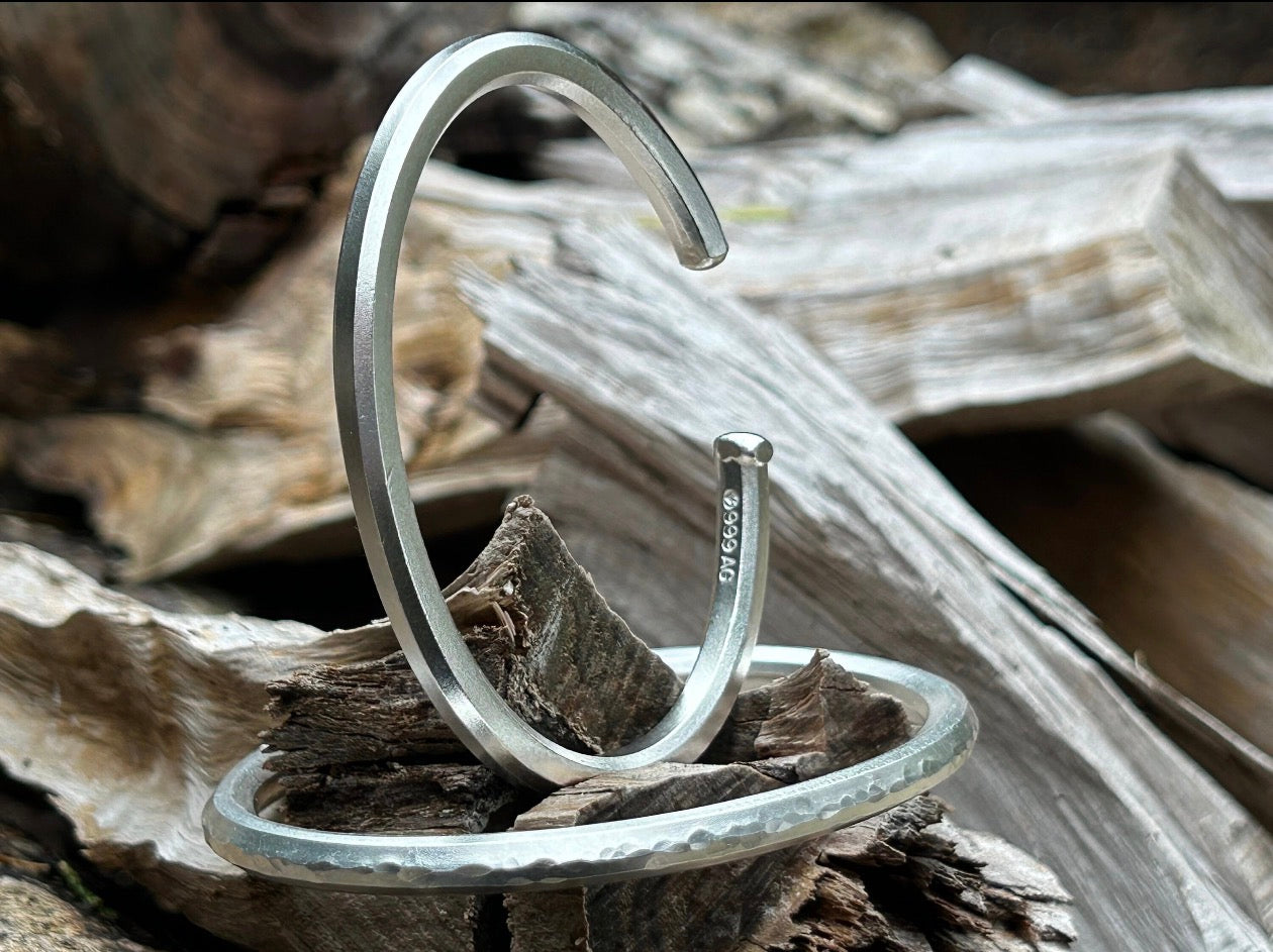 Original photograph showing the smooth cuff standing upright on wood